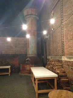 Philadelphia Design Hub: American Street Showroom - Photo 11 of 11 - The original smokestack from the roof of the showroom was retrofit to house a wood-fired pizza oven. Rumor has it that this smokestack oven can cook 10 pizzas in 90 seconds.