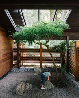 Aaron and Yuka Ruell transformed a Portland ranch house into a retro-inspired family home with plenty of spaces—like the trellised porch—for their four children to roam.