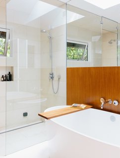 The master bath is a bright sanctuary with a freestanding tub by Victoria + Albert and Ecostat shower fixtures by Hansgrohe.