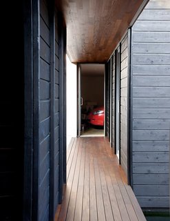An Atypical Modern Home in Southern California - Photo 5 of 15 - A perpendicular walkway leads right to the garage and laundry areas.