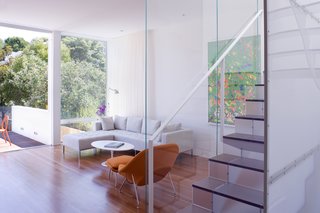 Noe Valley Renovation - Photo 12 of 17 - The living room, opposite the kitchen, provides a lounge area outfitted with a Womb chair and ottoman and Tulip coffee table by Eero Saarinen for Knoll and a Delano sectional sofa by Sphere Designs.<br><br>Photo by <br><br>Sharon Risedorph