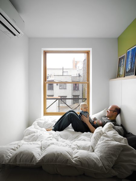 The bed takes up nearly the entire master bedroom, but it doesn’t make the space feel cramped. The wide window keeps the tiny box light.