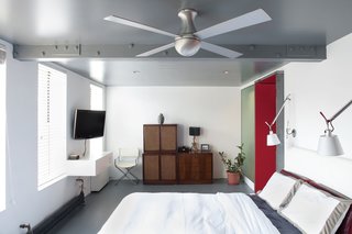 "Two-bedroom apartments are coveted in Manhattan, but the reality is that we are just two people, and the second bedroom had become neglected storage space," Fontanez says. Combining the two into one reaped big rewards. "Now we wake up to a row of four windows and a variety of birds singing," Russell says.