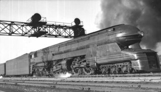 PRR S1 Locomotive for Pennsylvania Railroad (1939)<br><br>"It flashed by like a steel thunderbolt, the ground shaking under me, in a blast of air that almost sucked me into its whirlwind." Loewy’s description of this one-off locomotive he designed for the Pennsylvania Railroad company belies his talent for self-promotion. It also captures the excitement of this steel behemoth, a projectile at rest that’s more steampunk than anything Jules Verne could have imagined. Sadly, after debuting at the 1939 World’s fair, Loewy’s creation had a short career, retiring from the rails in the mid-’40s due to performance issues.