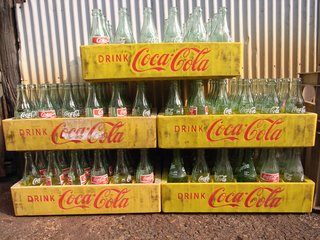 Coca-Cola Products<br><br>According to the Coca-Cola company, Loewy did not redesign the contoured bottle created by the Root Glass Company in 1915, which he called "the most perfect ‘fluid wrapper’ of the day and one of the classics in packaging history." He did, however, rework different versions of the bottle, as well as retool a variety of packing and promotional material for the soft drink giant, including soda fountains, coolers and delivery trucks.<br><br>Photo Credit: Toshiyuki IMAI, Creative Commons