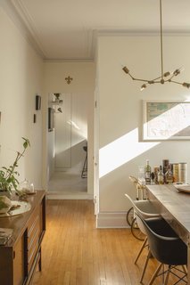 The Complete Dwell Guide to Eames Shellspotting - Photo 6 of 9 - The dining room adjacent to this clever Ikea kitchen hack includes some not so bargain-bin pieces, including Eames shell chairs from Herman Miller and a vintage Italian bar cart.