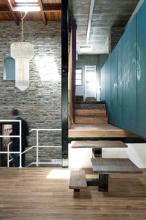 Modern Lilong House Renovation in Shanghai - Photo 1 of 11 - The interior consists of five different levels, all linked by a steel-and-wood staircase. Carbone sourced the chandelier from a local shop.