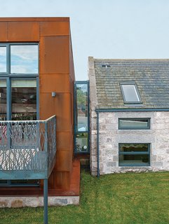 This Farmhouse is a Cor-Ten Steel-Clad Dream - Photo 2 of 11 - Cor-Ten steel from a ship building yard clads the new structure, which connects via a glass "bridge" to a rebuilt stone farmhouse containing the bedrooms.