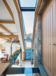 This Farmhouse is a Cor-Ten Steel-Clad Dream - Photo 4 of 11 - McAvoy worked with builder Stephen Campbell on structural elements such as the glass floor and walls.