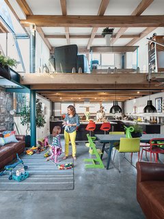 This Farmhouse is a Cor-Ten Steel-Clad Dream - Photo 5 of 11 - The bottom floor contains the kitchen and the dining area; the lounge is upstairs. The cabinets are from Ikea, as are the table and chairs, and the child’s Tripp Trapp chair is from Stokke.