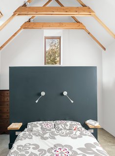 This Farmhouse is a Cor-Ten Steel-Clad Dream - Photo 6 of 11 - Designer Sue Macintosh chose the Farrow & Ball Off-Black paint for the master bedroom.