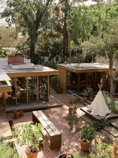 Josie’s tepee playhouse stands on a platform, where she and her friends erect sets for their theatrical productions.