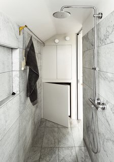 This Is How You Can Live Large in a Small Space - Photo 4 of 9 - The Salvatori marble tiles in the bathroom were added at the last minute, once everyone was confident that they would not put the project over budget.