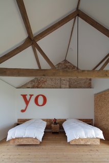 A Pair of English Barns Hide Unabashedly Bold and Budget-Friendly Minimalist Interiors - Photo 12 of 14 - Hard to imagine a more appealing (or friendly) guest room than this one in Ochre Barn.