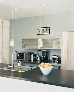 The Viking range and Bosch refrigerator in the kitchen are paired with Ikea lights and cabinets.