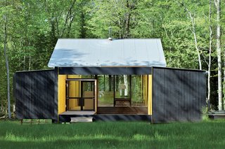 Architect Charlie Lazor opted for a wash of black on the prefab cabin he designed on Madeline Island, Wisconsin.