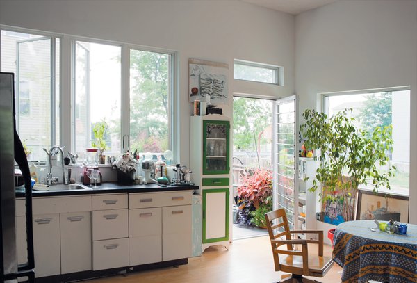The salvaged 1950s-era kitchen cabinets by Republic Steel, covered with a new Formica countertop, represent both a significant cost savings and Carpenter’s commitment to sustainability. The kitchen opens onto a 72-square-foot deck that offers a view of the Statue of Liberty.