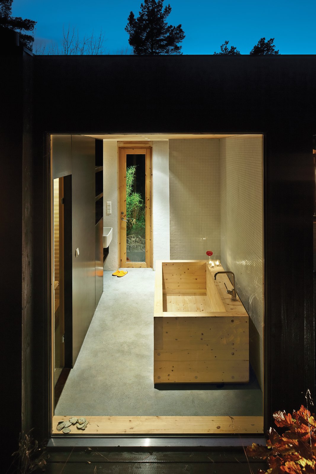 Sævik designed the wood tub in the bathroom, which features an adjacent sauna. The Inxx A5 faucet is by Mora.