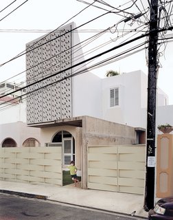 The perforated concrete panels on the façade of Casa Delpin.