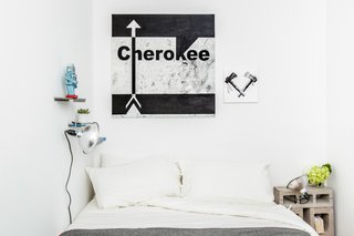 A Gut Renovation Transforms a Tiny Manhattan Apartment - Photo 8 of 8 - Another view of the master bedroom shows more original artwork by the New Design Project. Photo by Alan Gastelum.