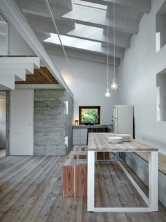 20 Dream Kitchens - Photo 15 of 20 - A pair of matching Idea lights by Vesoi over a dining room table and chairs, both locally-made.