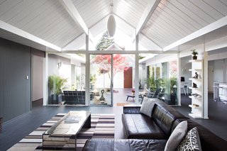 Here, the relationship between indoors and outdoors is on full display. The architects aimed to create a smooth transition between the two areas by incorporating glass doors that don’t obstruct any views. Photo by Mariko Reed.