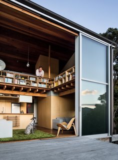 Open enclosures and connections to adjacent living spaces keep the home inviting and airy rather than densely packed—a key feature for an owner of two dogs: Ben, a whippet, and Flynn, an Irish gypsy dog.