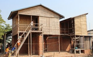 Courtyard House by Jess Lumley and Alexander Koller<br><br>Simplicity ruled for the English design team. They referenced and recast traditional elements, such as a brick wall, timber posts, and palm leaf matting and bamboo shutters, which created playful patterns of light.<br><br>Photo provided by Building Trust International