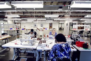Producing a watch band is a multi-step process. Leather is brought into the factory, slimmed down in a process called skiving, then layered together, cut into shape, heat-pressed together, then stitched. The last piece is attaching the watch face to the band.