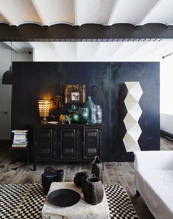 A tastemaker brings his distinct vision and vintage items to this industrial loft with a centuries-old pedigree.