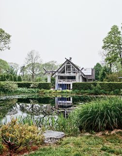 An installation by Dale Chihuly rests in the pond.
