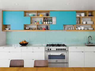 A Minimalist Duplex in Venice, California - Photo 3 of 9 - Don preferred closed cabinets for his kitchen but Dennis didn’t want doors swinging out. So Don designed plywood sliders that park at specific positions and fit together like puzzle pieces in Dennis’s space. Contractor Franklin Pineda custom-built the cabinets using Baltic birch plywood from Anderson Plywood. See more ways to design with plywood. 