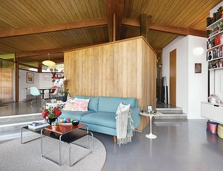 Elise Loehnen and Rob Fissmer bought their house, which dates to 1950, in 2012, furnishing the living room with a Jasper sofa by Room & Board, Laccio tables by Marcel Breuer, and a wool sisal rug from Madison Flooring and Design.