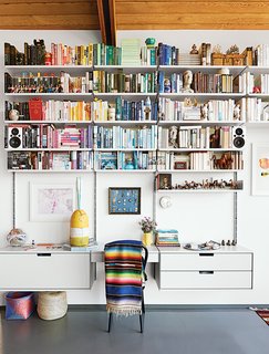 A Midcentury Home Keeps the History Alive - Photo 5 of 10 - A 606 Universal Shelving System by Dieter Rams for Vitsœ dominates one end of the living room.