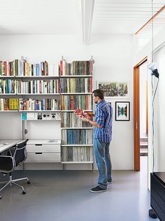 A Midcentury Home Keeps the History Alive - Photo 9 of 10 - "It’s like Lego for grown-ups," Fissmer says of Rams’s 606 Universal Shelving System for Vitsœ, which makes another appearance in the office. "It’s a responsible way to handle storage."