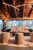 Berkus has gone through over 1,000 renovations in his career and has learned some key design lessons along the way. “I have such a passion for discovering and reusing vintage building materials and architectural savage,” Berkus says. “In my last home in New York, I found a set of four doorknobs with locks from Belgium in the 1940s and I had iron glass doors installed to work around them. I knew myself to know that the knobs I touched everyday would be something meaningful to me.”
Pictured, an enclosed porch in a rundown rustic cabin in Big Bear, California, updated by Lukas Machnik. Photo courtesy NBC. Photo of Renovation Tips from American Dream Builders' Nate Berkus modern home