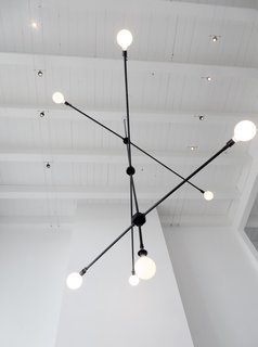 Q&A With American Dream Builders Finalist Lukas Machnik - Photo 7 of 7 - Lukas creates this lighting fixture by assembling metal conduit pieces from Lowe's. He also created a chandelier from hanging lanterns. "I like taking old materials and making something new." Photo courtesy of Lukas Machnik.