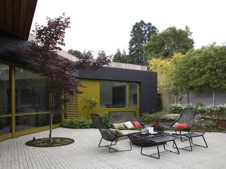 A selection of pieces from the Maia outdoor collection by Patricia Urquiola for Kettal make up the seating area outside.
