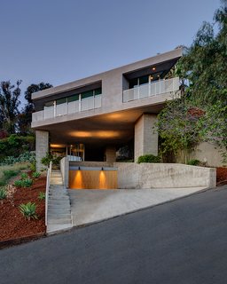 I Love Modern Architecture - Photo 14 of 20 - This cantilevered home by Escher GuneWardena Architecture in the Silver Lake neighborhood hovers above the sloping site, supported by five piers covered in vines. The architects sharply angled the street facade, offering views of the nearby lake. Photo by EGP Imaging.