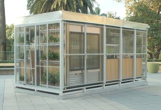 You'll Yearn For Summer After You See This Prefab Bar - Photo 3 of 6 - A Portable Bar<br><br>A series of five big metal rings linked by a four longitudinal beams forms the skeleton of the structure, built in studio and assembles on site. Clad in transparent sinusoidal polycarbonate sheets and filled with furniture crafted by the trio from guatambu hardwood panels, it can be easily disassembled, transported and then assembled again. There are plans to build additional mobile structures similar to Refugio, as well as commercial displays and more furniture, but at the moment, the multidisciplinary It Met is content to sit behind the bar’s three taps and take it all in.