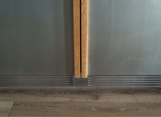 This Cozy Home Totally Changes How We Think of Tribeca Lofts - Photo 4 of 9 - Liebherr refrigerator was customized with an integrated zinc front to match the cabinetry.