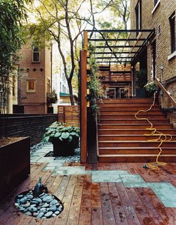 The Zizmors didn't want to use curtains to screen their wide-open home from noisy neighbors. Instead, Kari Elwell Katzander of Mingo Design, an urban landscaper, created a living wall of wooden planters and English ivy that provides privacy without blocking light.
