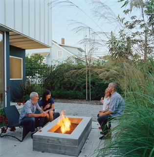California isn't known for its front porch culture, but Grunbaum loves Venice's walk streets and their pedestrian vibe, so he employed landscape designer Stephanie Bartron to orient his small patio towards the street. The house itself acts as a windbreak, and lush patio furniture and a small fire pit turn what could have been another exercise in backyard solipsism into the home's most neighborly spot.
