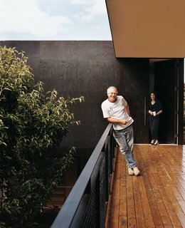 The house’s residents, Diane and Hayden Roberts, stand outside to admire the views that their son Aaron has given them in his design for the house.