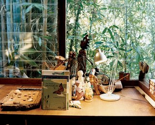 The grandchildrens' room, on the same, well-lit side of the house as Ray's office, is adorned with dolls and books.