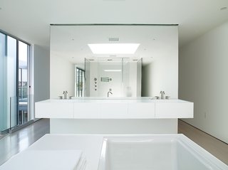 The master bathroom is outfitted with Kohler fixtures and custom pieces.