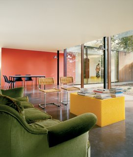Two glass facades in the living space allow for an unencumbered view of the beech tree.