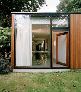 The exterior is clad in louro gamela, a tropical hardwood.
