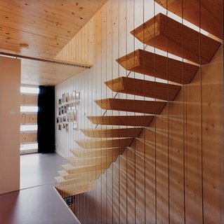 The "floating" staircase is actually supported by steel rods hidden within each step.