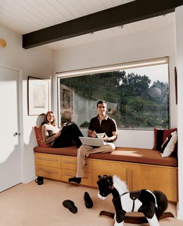 By eliminating the drop ceilings, the architects opened up the ground level, which had been broken up into several rooms. This not only revealed the original beams, it also brought a much more expansive sense of space.